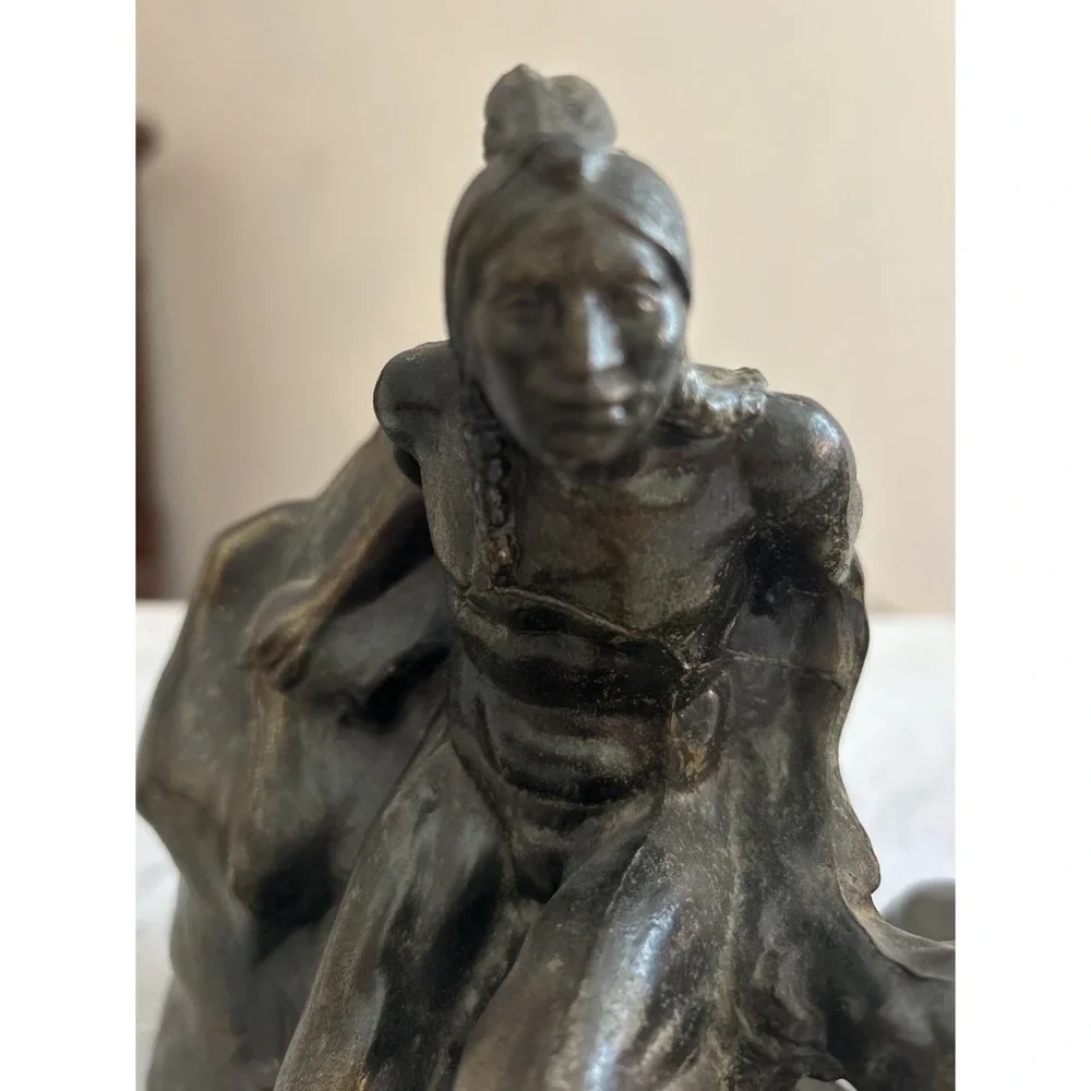 Antique Meal metal cast Indian bookends. Good condition.